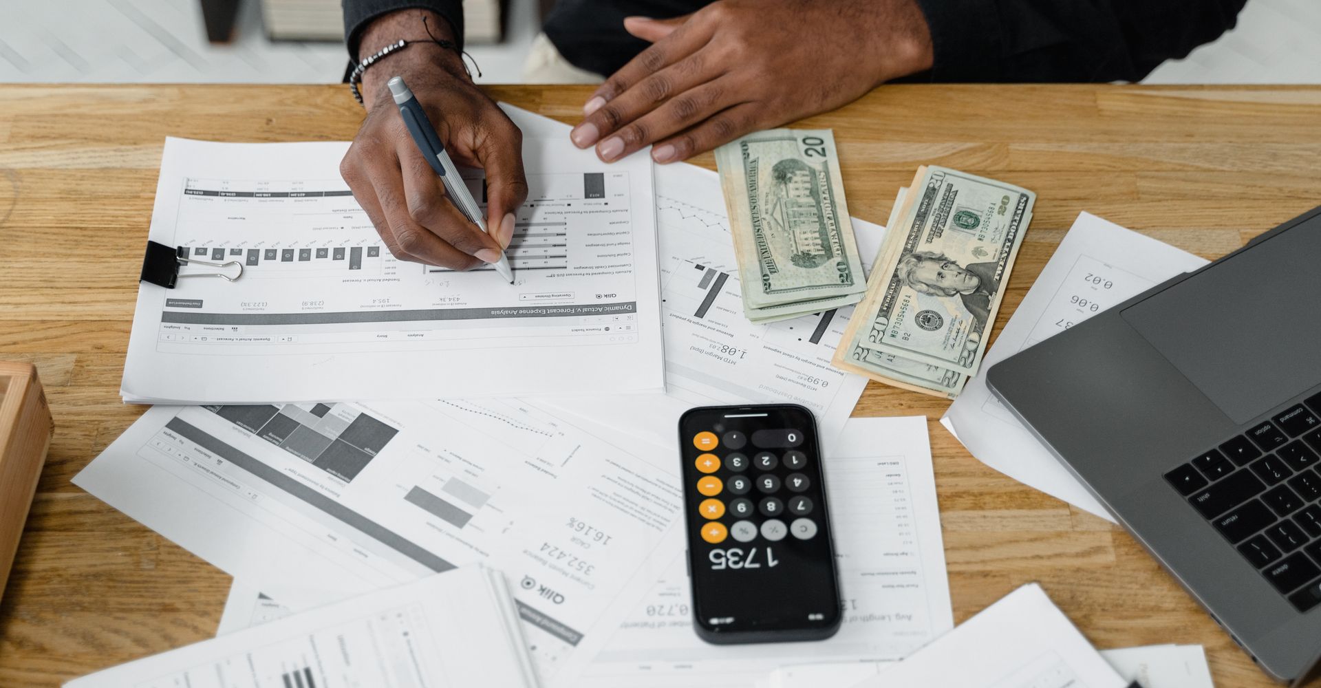 A government contract controller reviewing indirect rate schedules and job cost reports, the kind of DCAA-compliant accounting talent Spectrum Careers places with GovCon employers