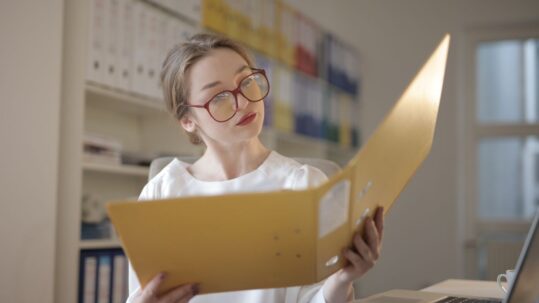 Accountant reviewing financial documents at a desk