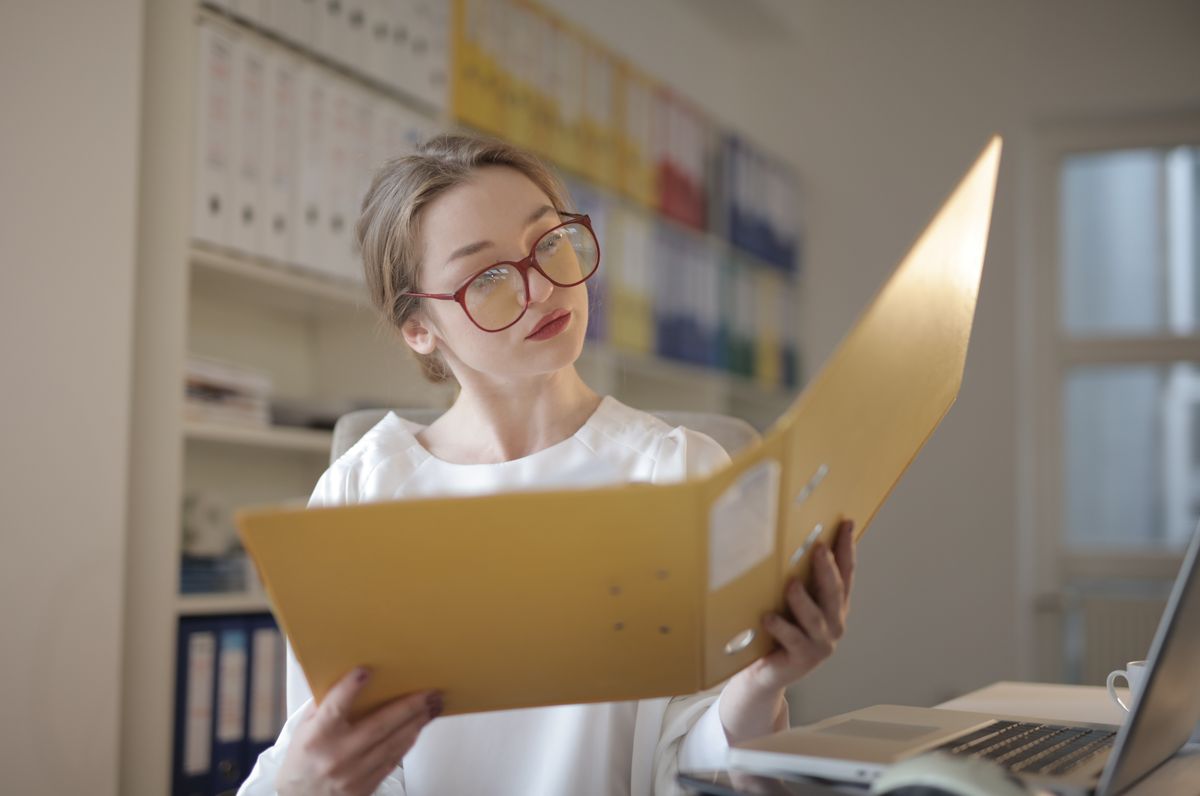 Accountant reviewing financial documents at a desk