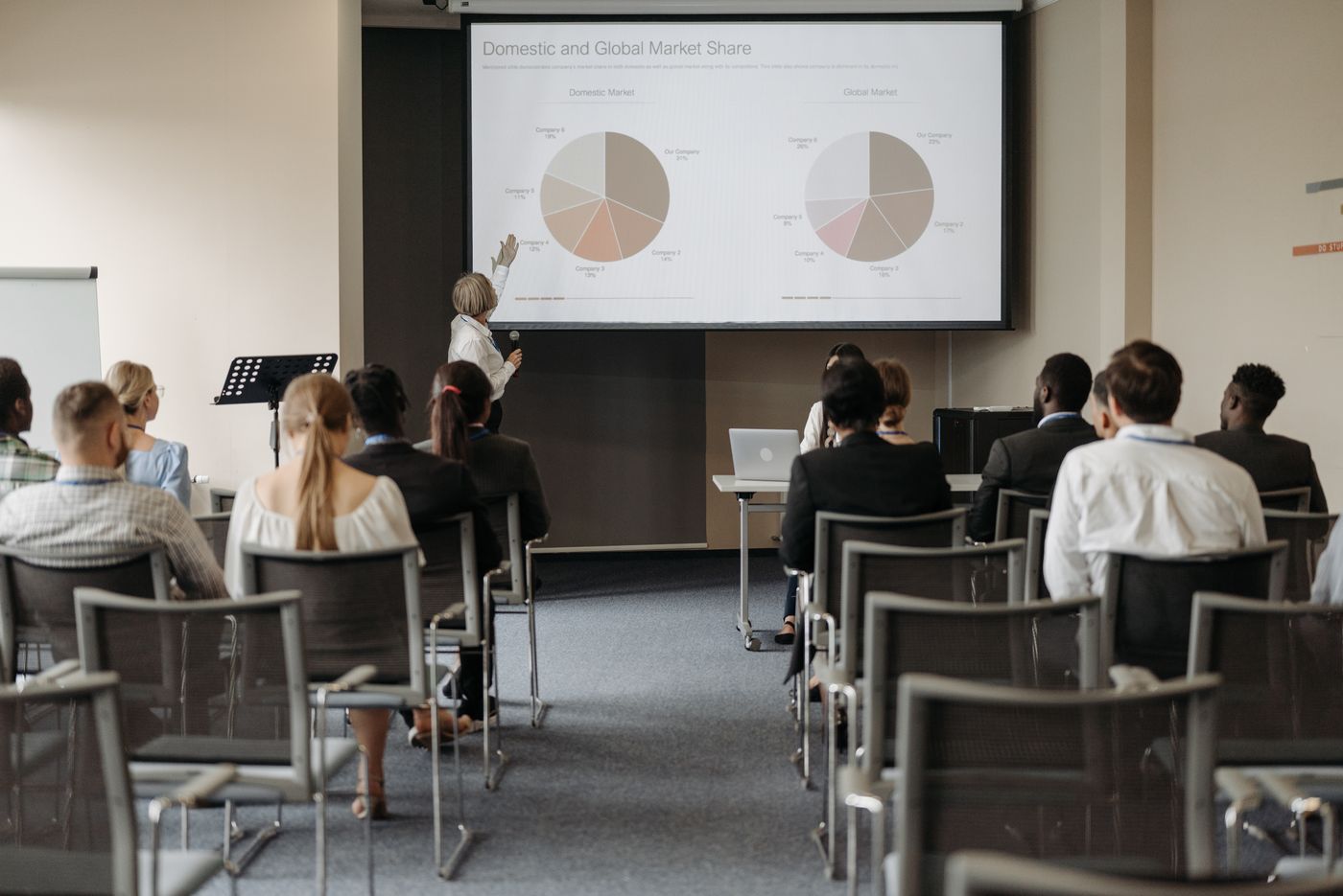 An association conference presentation with members reviewing market data